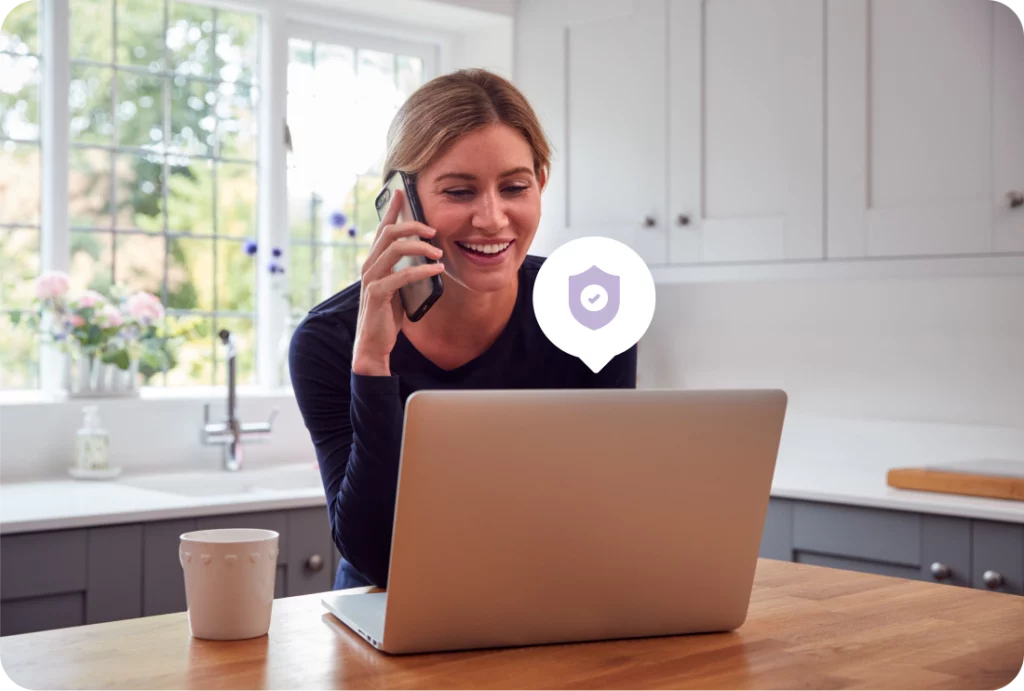 Women on phone looking at computer