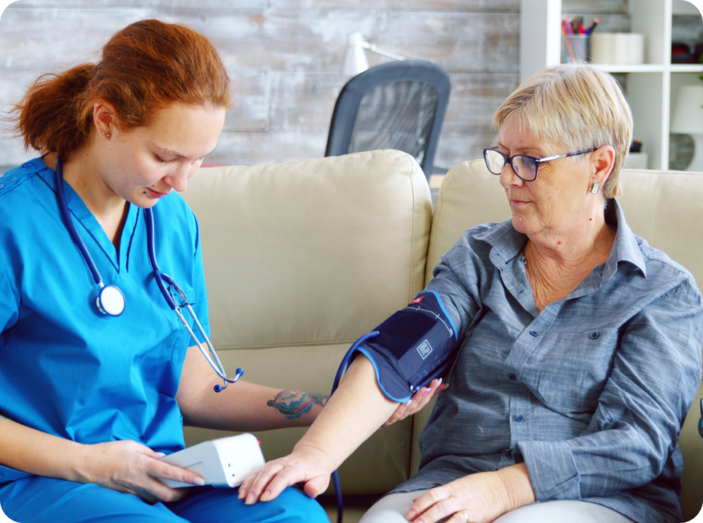 Nurse taking a womens blood pressure