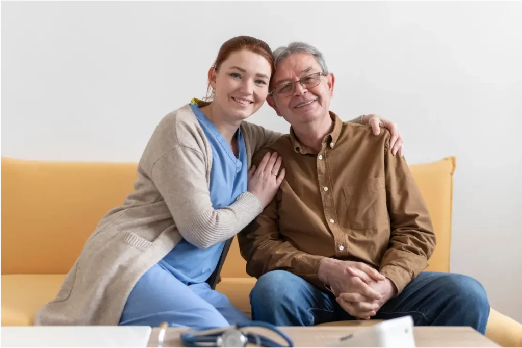 Nurse hugging a senior in-home patient